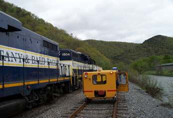The excursion meets a train in the yard.